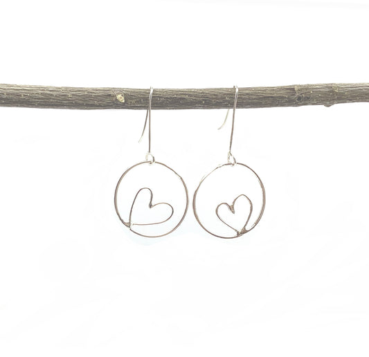 Sterling silver hoop earrings with hearts