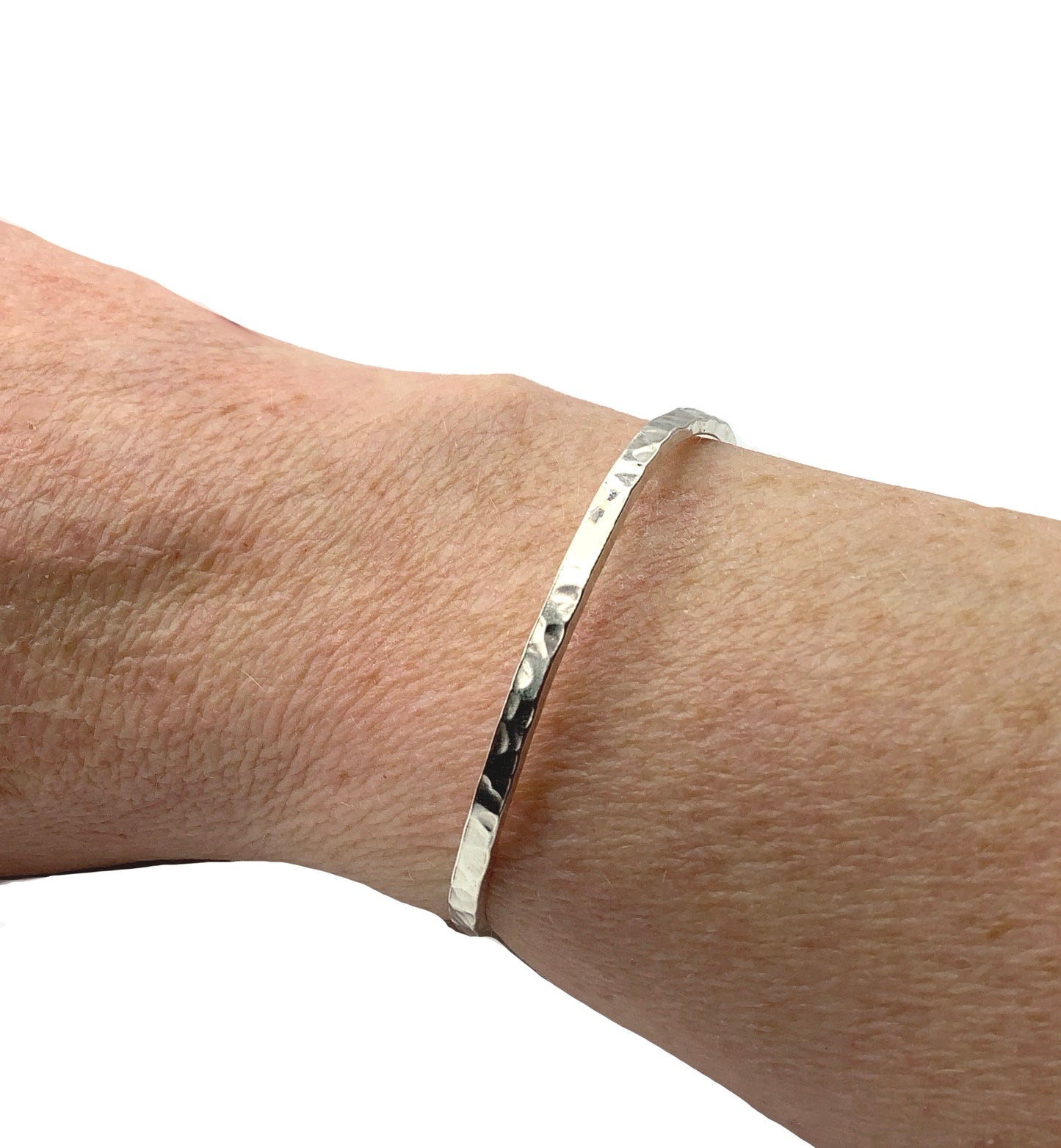 Sterling silver battered bangle with two balls