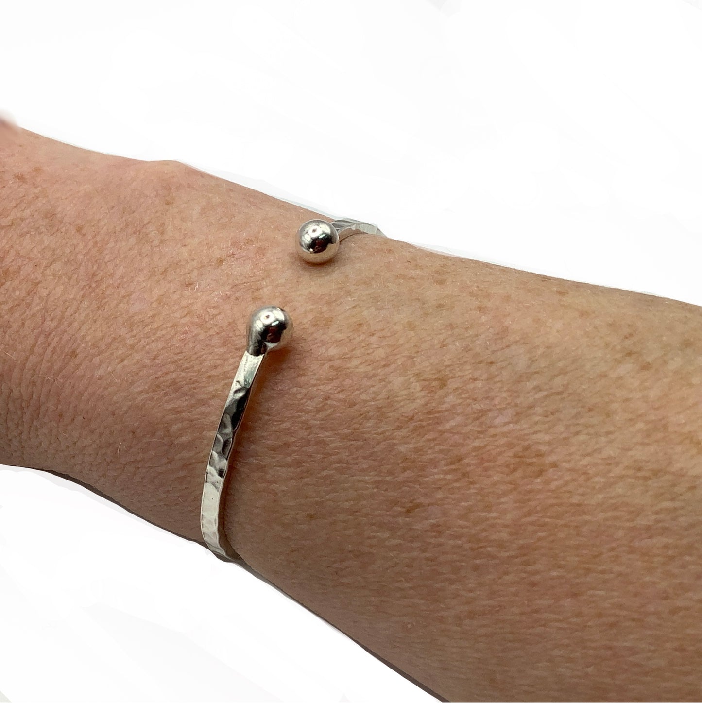 Sterling silver battered bangle with two balls